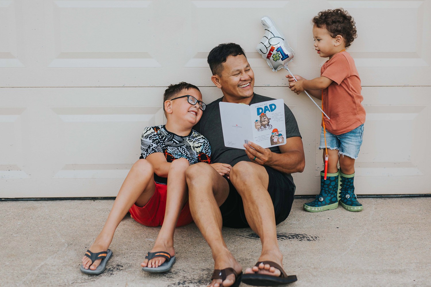 father with two sons celebrating fathers day